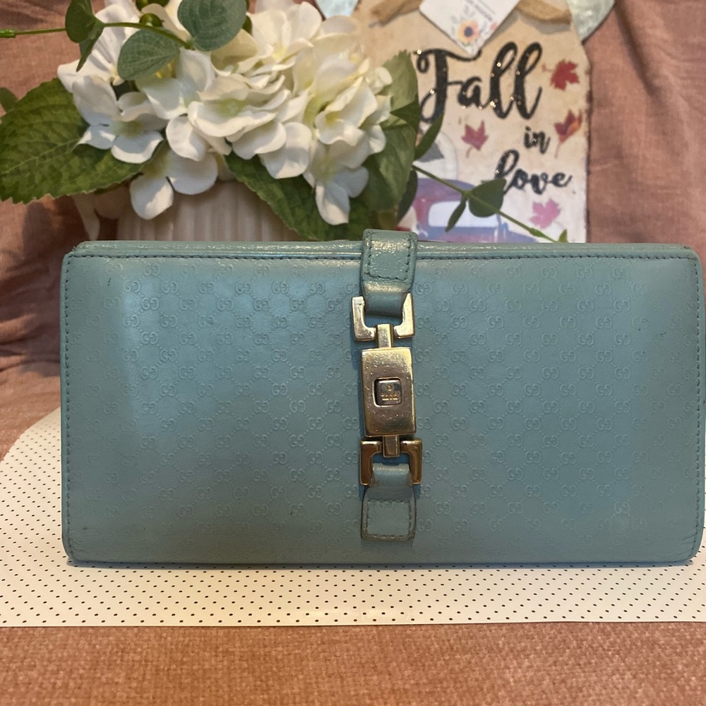 Gucci Jackie long wallet with locking clasp.